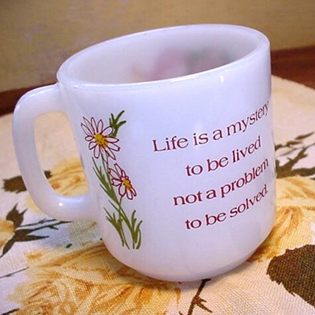 mug with life is a mystery on it